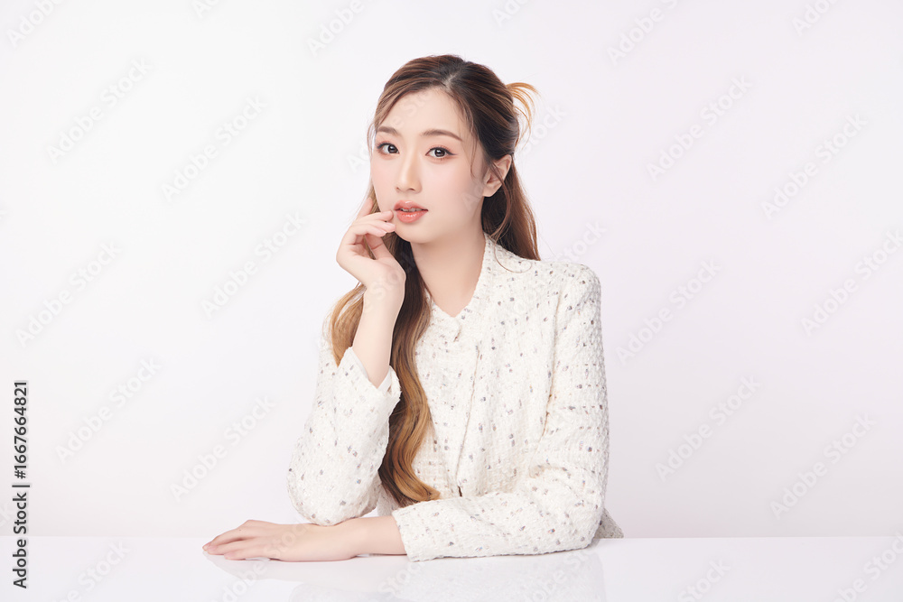 A beautiful young Asian woman with clean, fresh skin against a white background. Skincare, facial treatment, cosmetology, beauty, and spa. An elegant portrait of an Asian woman. A beautiful young Asian woman with clean, fresh skin against a white background. Skincare, facial treatment, cosmetology, beauty, and spa. An elegant portrait of an Asian woman.