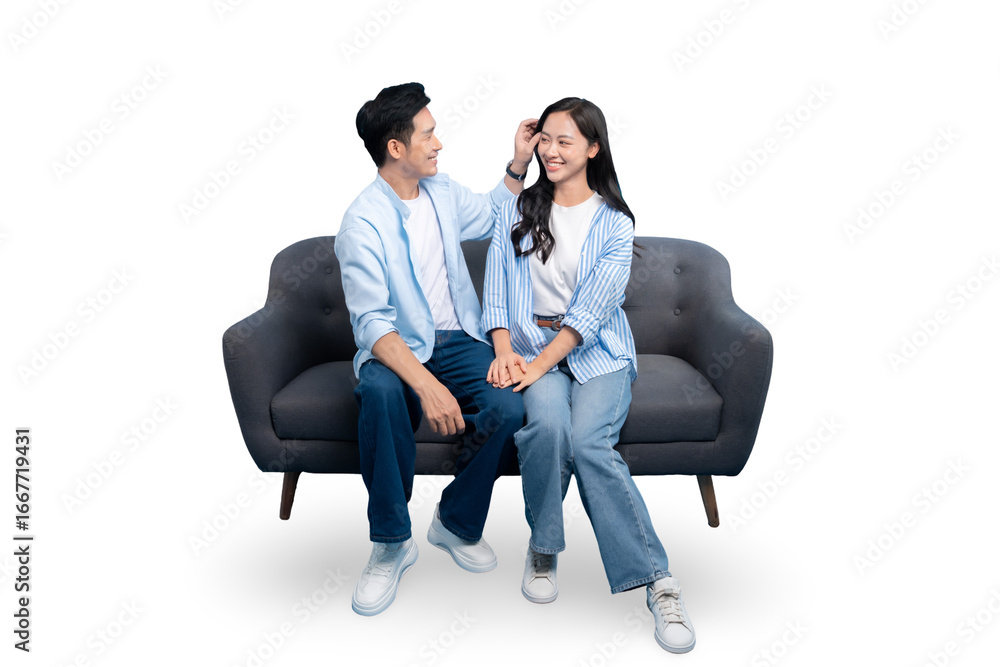Obraz premium A happy couple sitting on a sofa together. This photo captures a beautiful moment of tenderness and affection on PNG background