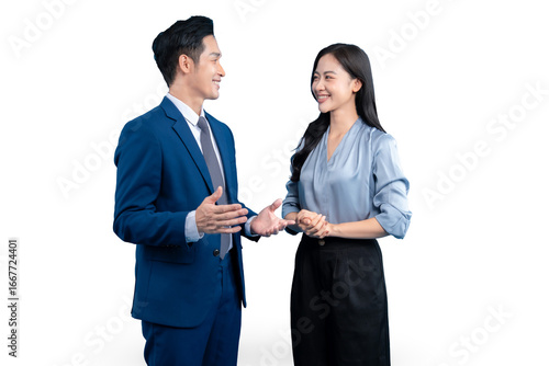 Two business partners smiling and talking in an office setting on PNG background