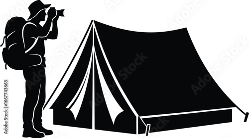 Silhouette of a man with a backpack taking a photo near a tent, capturing essence of outdoor adventure and spirit of exploration