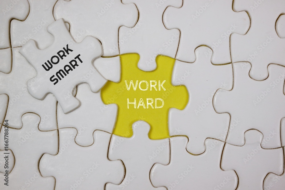 Fototapeta premium Conceptual Puzzle Representing Hard Work and Smart Work Techniques, highlighted in yellow and white puzzle