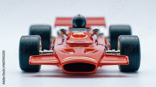 Wallpaper Mural Red toy formula car facing forward with thick black tires and silver details Torontodigital.ca