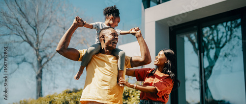 Happy African family spending time together outdoors