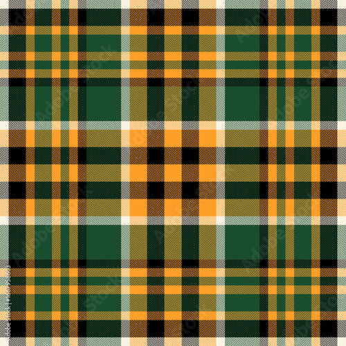 Classic tartan pattern in green and gold hues. Herringbone texture adds depth. Ideal for backgrounds, textiles, or design projects with a heritage feel.
