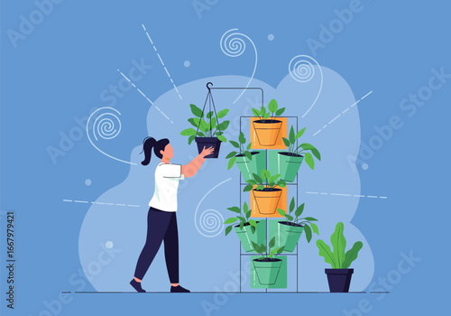 Person caring for a vertical garden of lush green plants outdoors