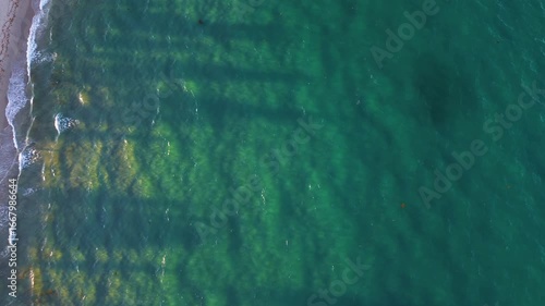 Amazing drone video of sunset rays shinning through aquamarine waters in Delray Beach Florida.