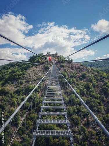 Sellano, Italy - August 24, 2025, first-person view from a section of the new 175-meter-high Tibetan bridge, the highest in Europe, connecting the Italian municipality of Sellano to Montesanto Castle.