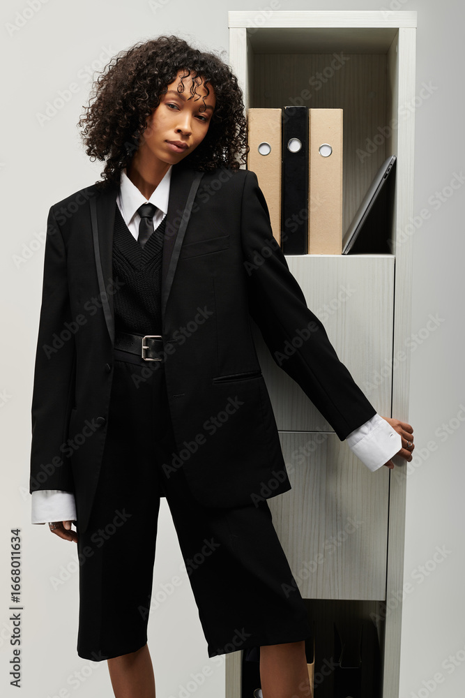Confident young woman showcases modern elegance in tailored business attire Confident young woman showcases modern elegance in tailored business attire