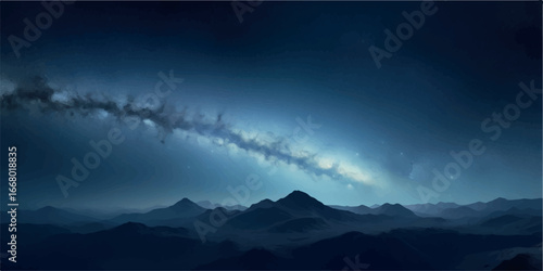 A dramatic view of the milky way galaxys glowing band illuminating a deep blue night sky above dark mountains