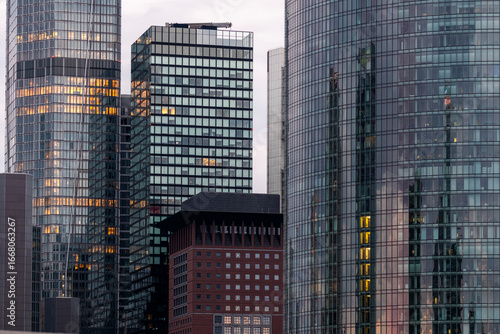 Skyscrapers of Frankfurt, Germany, with reflective glass facades at sunset, capturing contemporary architectural rhythm and the identity of Europe’s evolving financial district