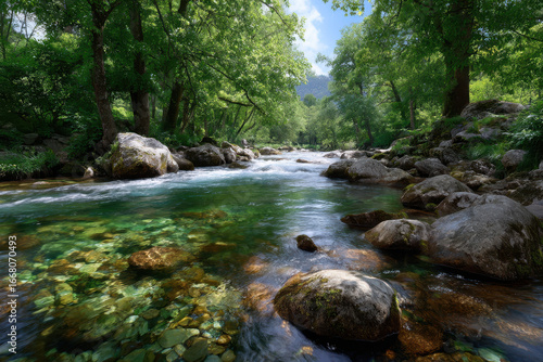 Tranquil river flowing through lush greenery under a bright blue sky on a sunny day