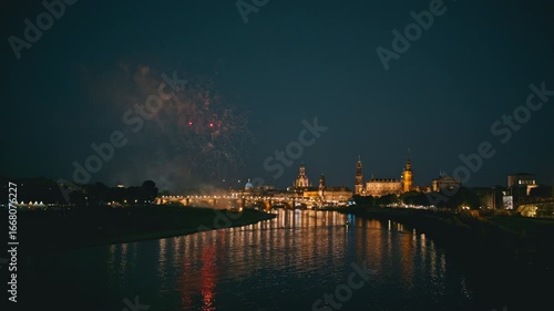05. Colorful fireworks light up the night sky over Dresden during the Canaletto festival on City Day. The historic skyline and reflections on the Elbe River create a festive and vibrant atmosphere.