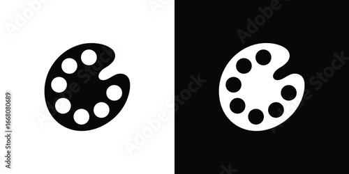 Palette with Paint in black on white and white on black, artistic creativity