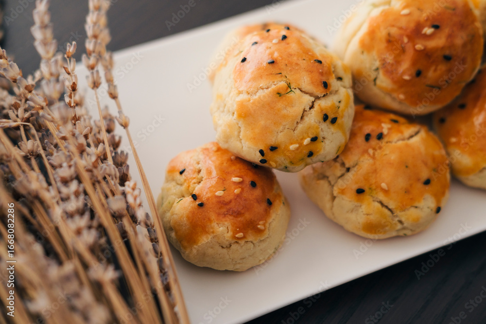 Fototapeta premium turkish savory pastry pogaca with dill and black sesame or cumin, homemade quick snack
