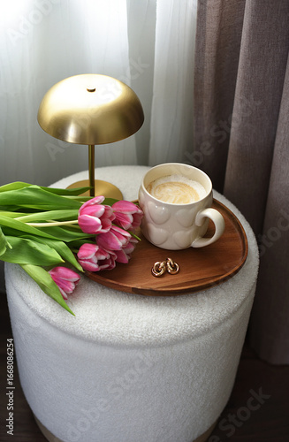 Cup with cappuccino, spring flowers tulips, morning concept, woman's day, bedroom design, gold modern desk lamp