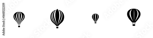 Hot air balloons in varying sizes floating against a plain background during a calm afternoon