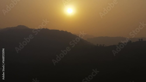 Wallpaper Mural Aerial view of the scenic hills shrouded in golden light as the sun sets, creating a tranquil and picturesque landscape, Bandarban, Chittagong Division, Bangladesh. Torontodigital.ca