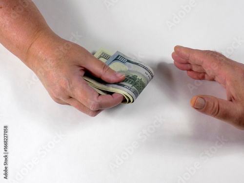 Payment in cash. Corruption, bribery. Money in hand.