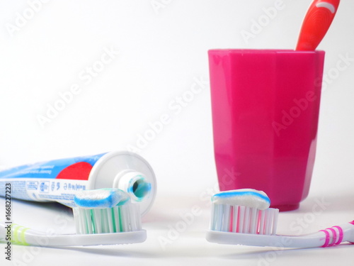 Oral hygiene. Toothbrushes and rinsing glass.