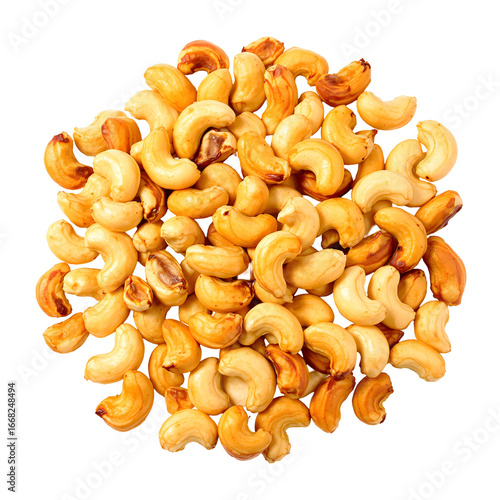 Golden roasted cashew nuts in a heap, an energy-rich and tasty snack, viewed from above and isolated on a clean white background