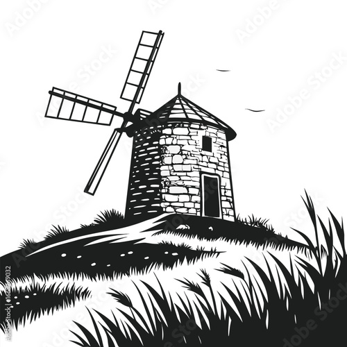 Ancient windmill in mountain meadow silhouette