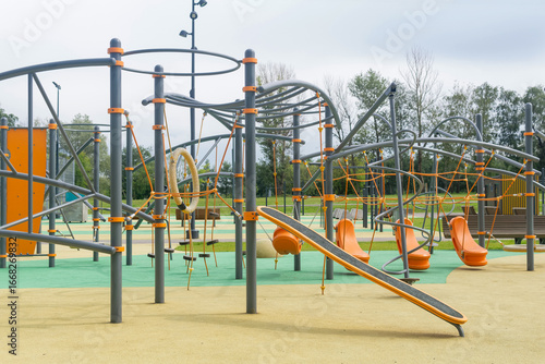 Playground for children in the city park on a sunny summer day