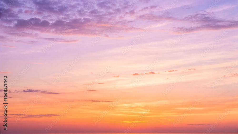 Fototapeta premium Vibrant sunset sky with colorful clouds in shades of purple pink and orange image photo