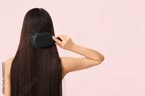 Young woman brushing her lo...