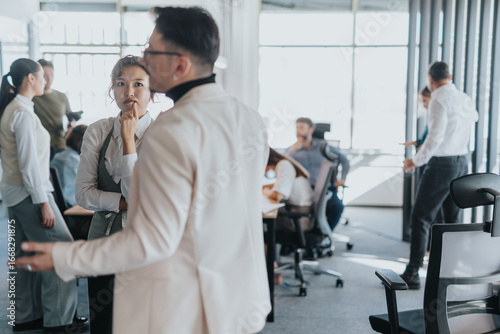 Photography A bustling office scene showcasing multicultural employees engaged in a business meeting