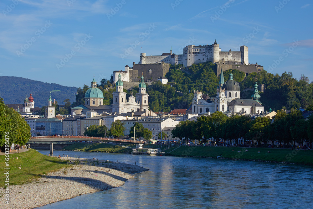 Naklejka premium Cityscape of Salzburg with the historic Hohensalzburg Fortress on hilltop, Austria