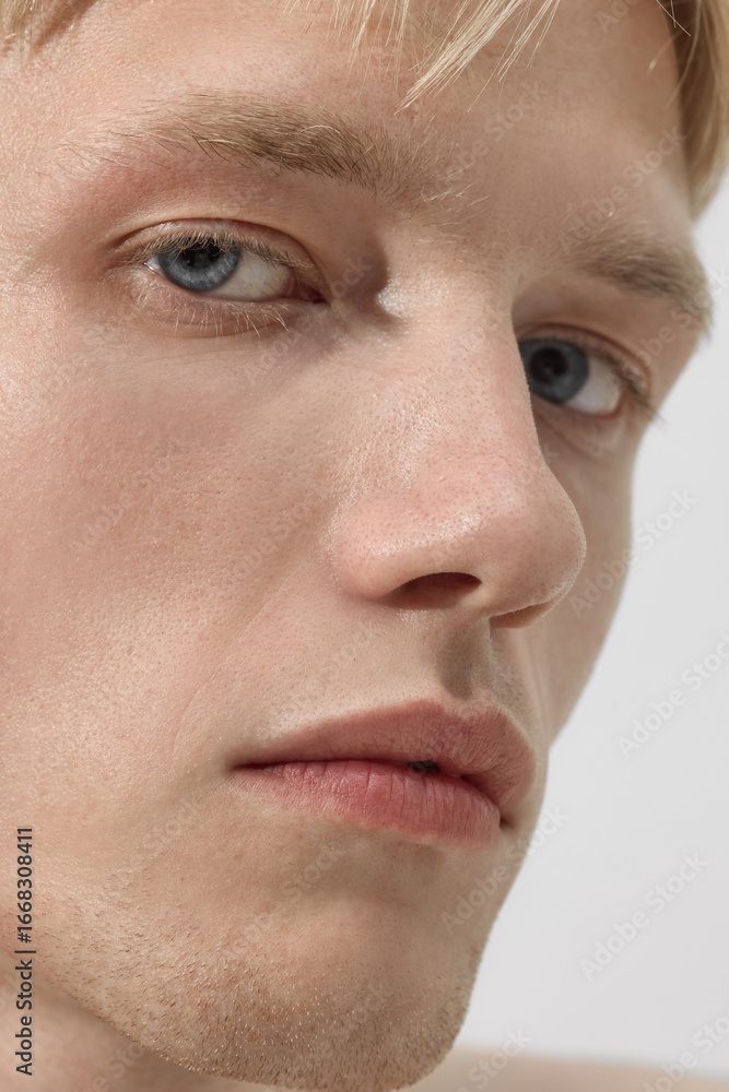 Obraz premium Extreme close up male face with skin texture detail. Concept of dermatology, cosmetic campaign, wellness platform, beauty editorial, packaging design, and skincare education for men.