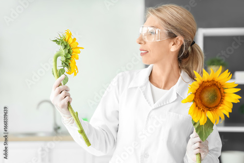 Happy female scientist with...