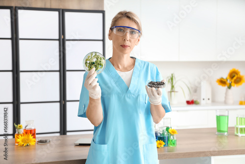 Female scientist with Petri...