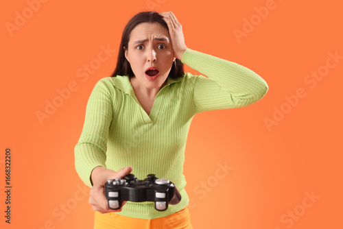 Shocked young woman playing...