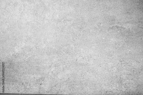 Light gray concrete wall surface with subtle scratches and textured background