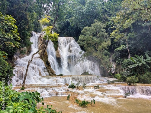 heavy water at Kuang Si Waterfall Cascading Through Lush Jungle in Luang Prabang, Laos – Tropical Nature Escape