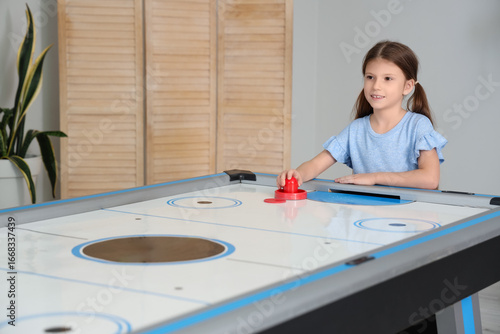 Little girl playing air hoc...