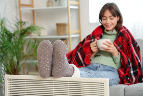 Young woman in warm socks w...