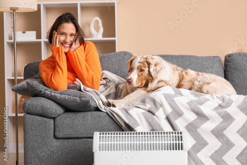 Young woman with blanket an...