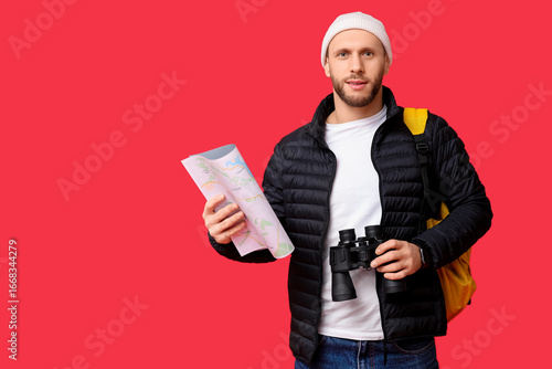 Young male tourist with bac...