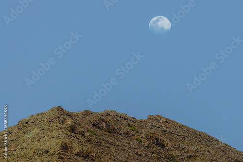 Moon shining over volcanic landscape in lanzarote, canary islands