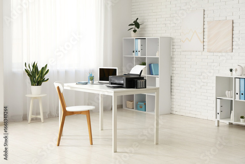 Stylish workplace with mode...