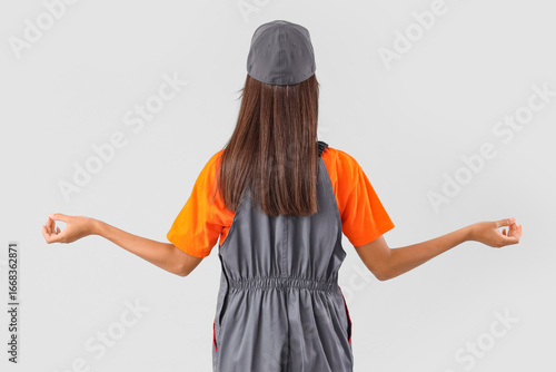 Female worker meditating on...