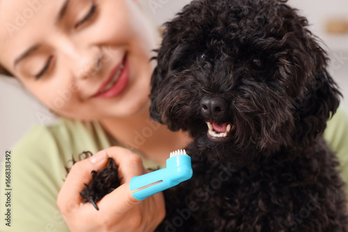 Young woman with toothbrush...