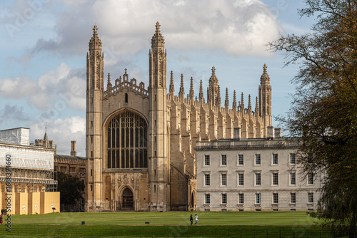 Cambridge, England. Western facade of King's College Chapel, built 1446-1515 in late Gothic style, and Gibbs Building by James Gibbs, 1724-1732, viewed from The Backs with green lawns