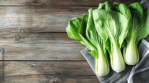 Fresh bok choy on wooden table, organic vegetable ingredient scene
