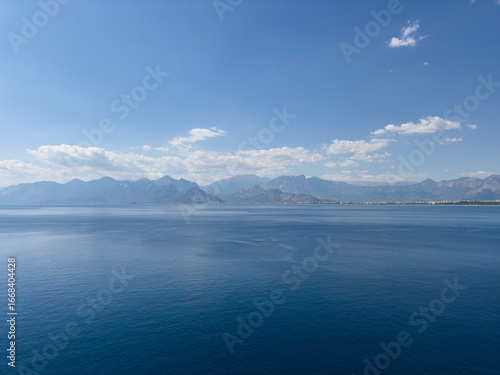 deep blue sea and beautiful distant mountains