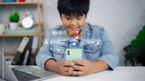 Bild auf Leinwand Asian boy using smartphone with social media icons and online communication conc