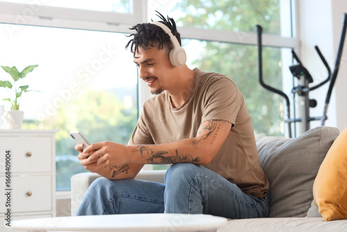 Young man with dreadlocks i...