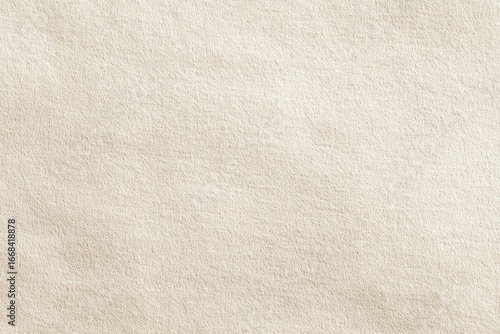 Close-up of a subtly textured, off-white surface; possibly fabric or paper, showing slight undulations and a soft, matte finish